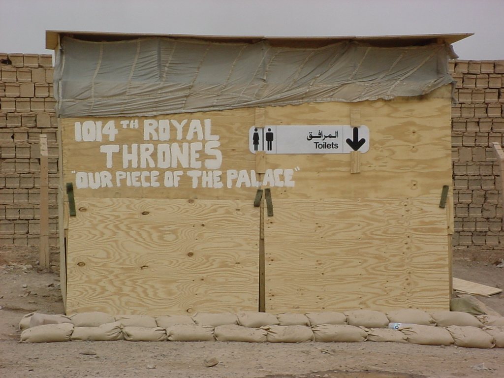 The company latrine, signed “1014th Royal Thrones: Our Piece of the Palace,” May 2003.